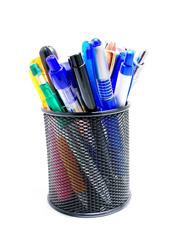 Black office pot with pencils and pens on a white background.