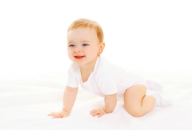 istock Happy smiling baby crawls on a white background 512156082