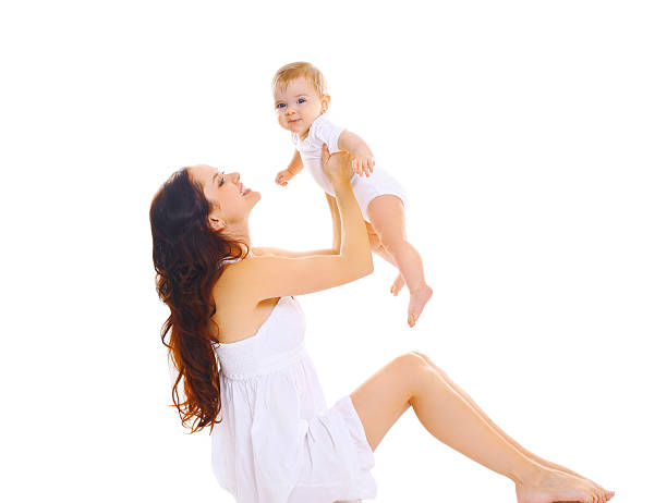 istock Happy young mother playing with baby on a white background 512156792