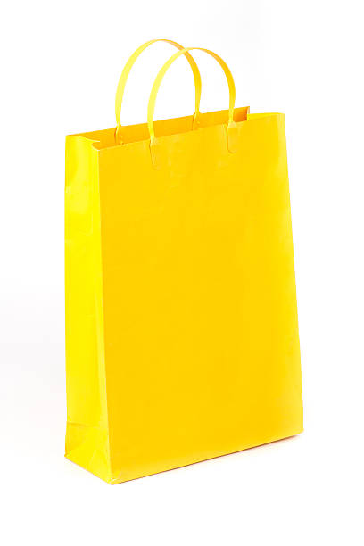 istock Yellow paper shopping bag 512156820