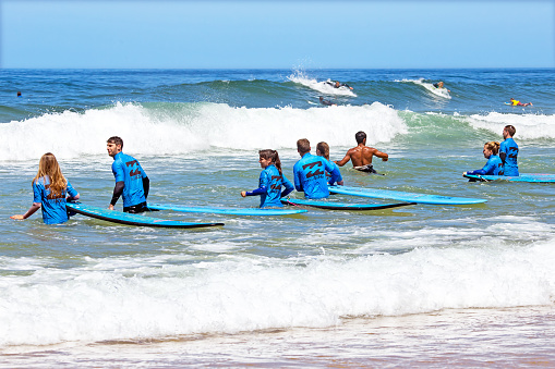 Vale Figueiras, Portugal - August 20, 2014: Surfers getting surfers lessons on the famous surfers beach Vale Figueiras in Portugal