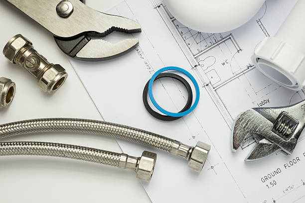 istock Plumbing tools and parts on house plans 512157252