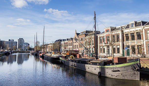 Leeuwarden, Netherlands - February 16, 2016: Old ships at a canal in Leeuwarden, Netherlands