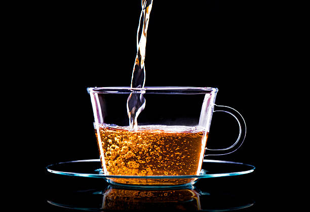 istock Pouring green tea in a glass 512160722
