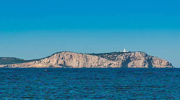 istock Mid day sun on the island lighthouse in Ibiza. 512161602