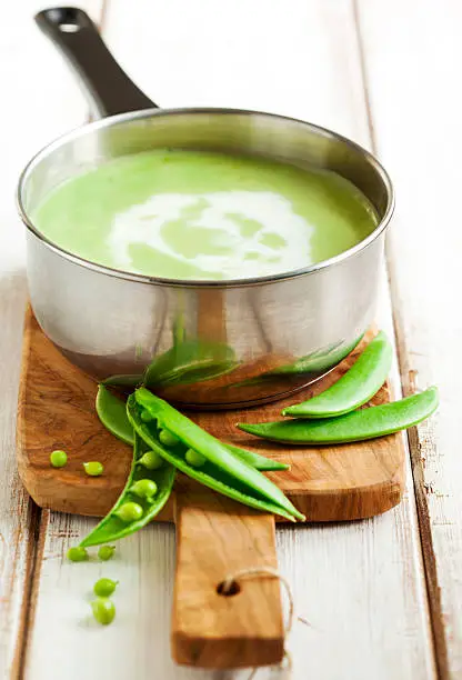 Green peas soup in pan