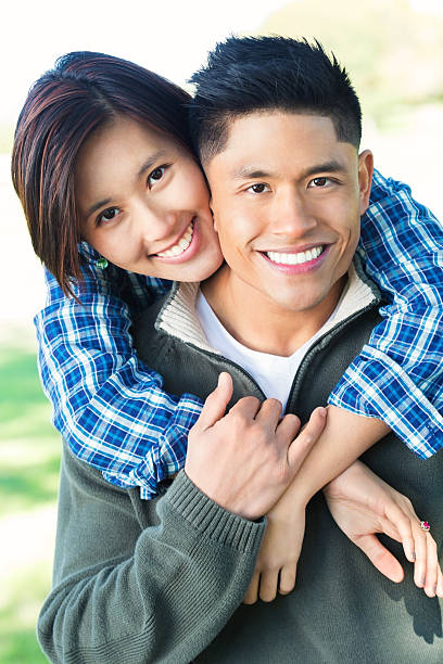 istock Young Asian couple in the park 512167120