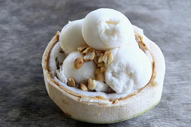 Coconut ice cream with nuts stock photo