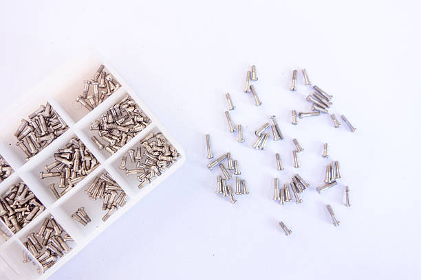 istock Closeup metal screw (bolt) and nuts 512170678