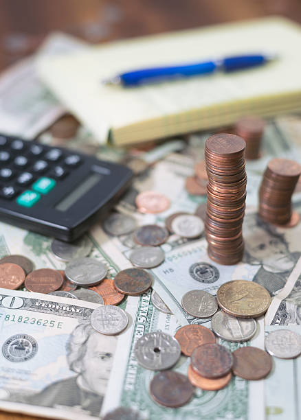 istock household budget planning workspace with money and calculator 512170860
