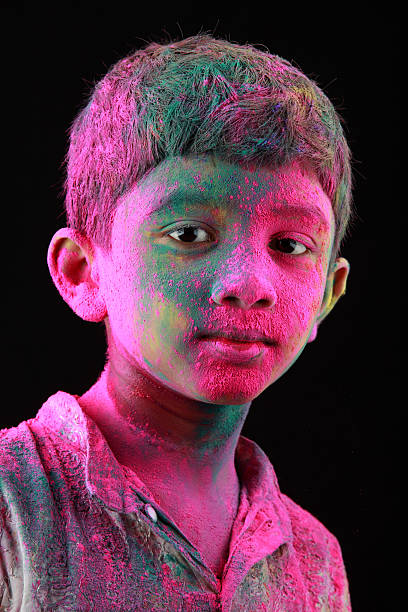 istock Portrait of boy with face smeared with colored powder 512171418