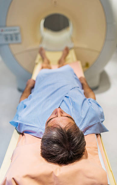 istock Mature patient receiving MRI Scan. 512171671