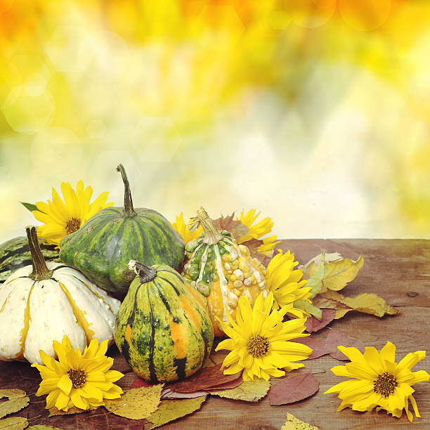 istock Autumn pumpkins with leaves on wooden table 512172671