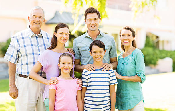 istock Smiling Multi-Generation Family In Front Garden 512172813