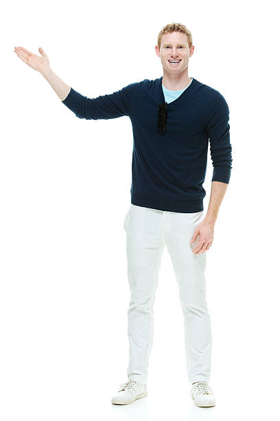 istock Man in winter clothing showing something 512172879