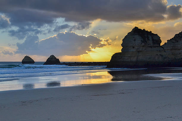 istock Rocks at the beach at sunset 512172975
