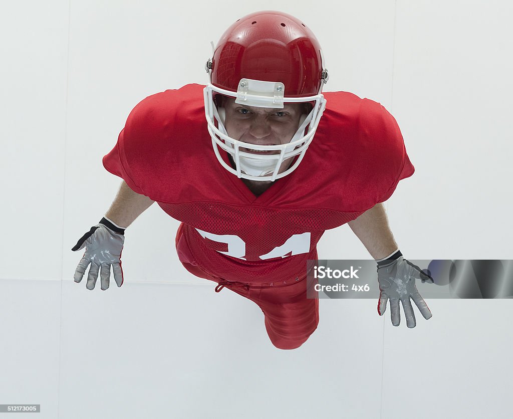Above view of American football player cheering Above view of American football player cheeringhttp://www.twodozendesign.info/i/1.png 20-29 Years Stock Photo
