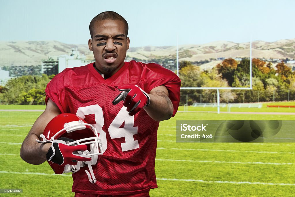 Aggressive American football player pointing Aggressive American football player pointinghttp://www.twodozendesign.info/i/1.png 20-29 Years Stock Photo