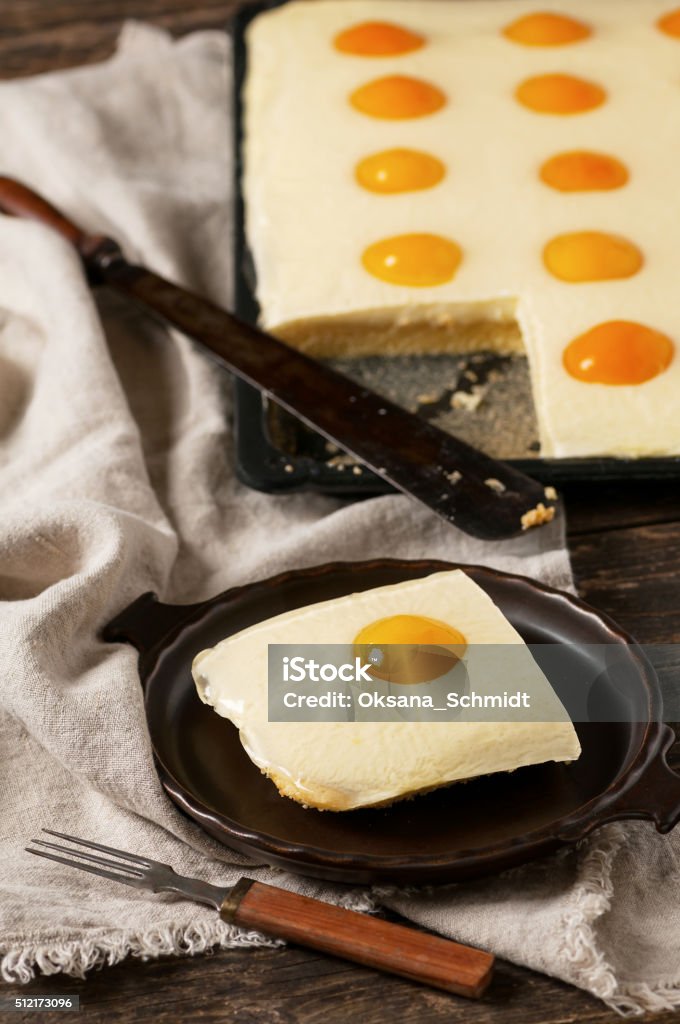 Slice of fresh homemade apricot cake. Slice of fresh homemade apricot cake. "Fried eggs" apricot cake. Selective focus.  Apricot Stock Photo