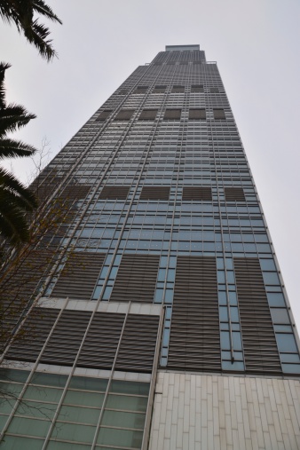 Nina Tower, a modern skyscraper in Tsuen Wan, New Territories, Hong Kong. The tower was designed to be the tallest tower in the world at 518 m However, due to its location near Chek Lap Kok Airport, the height was restricted to the current 319.8 m.