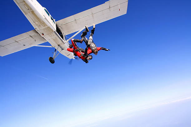 Jump Parachuters jumping from the plane skydiving stock pictures, royalty-free photos & images