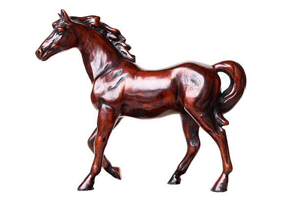 istock Walking horse sculpture isolated on white background 512187357
