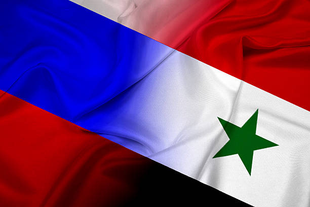 istock Waving Russia and Syria Flag 512188809