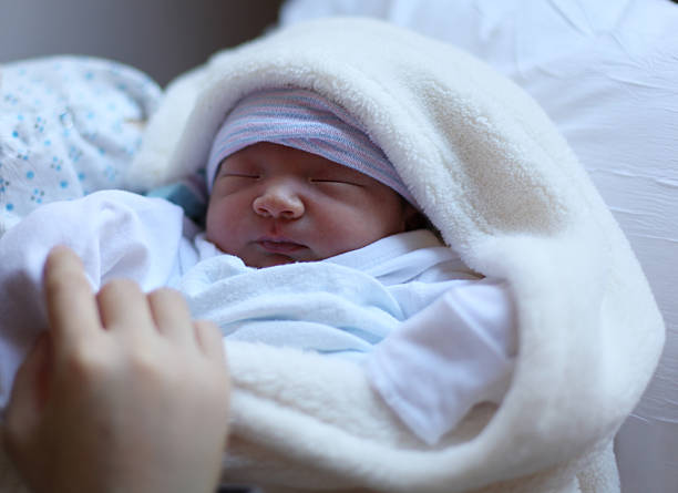 istock Newborn baby boy naps. 512188937