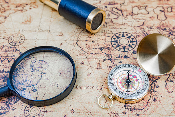istock Treasure Map with old Compass telescope and magnifying glass 512200702
