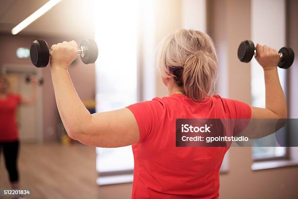 Working On Shoulders In This Age Is Important For Women Stock Photo - Download Image Now
