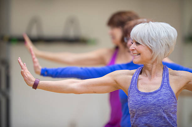 istock Women Taking a Yoga Class at the Gym 512202976