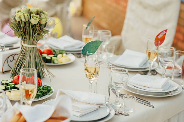 istock Wedding glasses filled with champagne at banquet 512203248