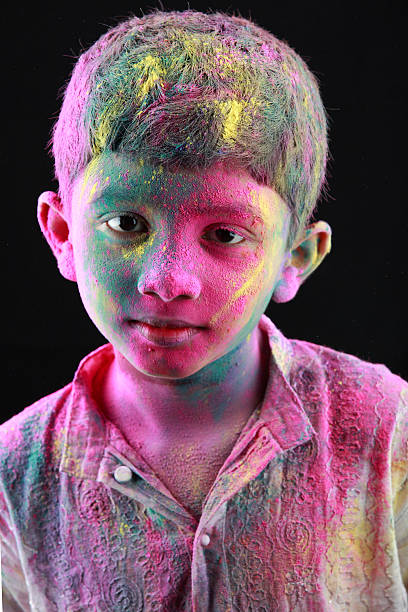 istock Portrait of boy with face smeared with colored powder. 512203526