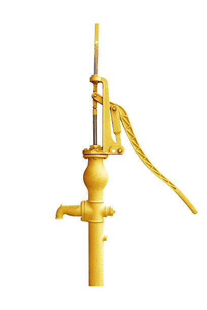 High-angle view of yellow pipe releasing turbid water into the environment, highlighting industrial structures and possible contamination issues in the surrounding area.