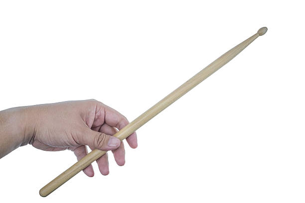 istock Isolated male left hand holding drum stick 512204834