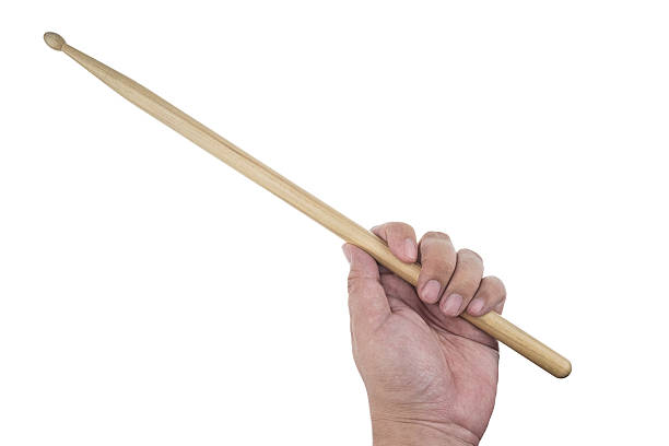 istock Isolated male left hand holding drum stick 512204876