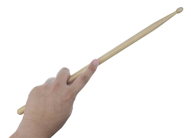 istock Isolated male left hand holding drum stick 512204888