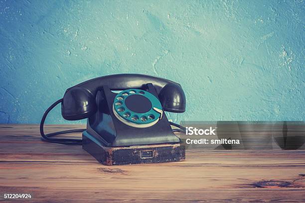 Vintage Phone On A Wooden Table Stock Photo - Download Image Now - Telephone, Old-fashioned, Retro Style