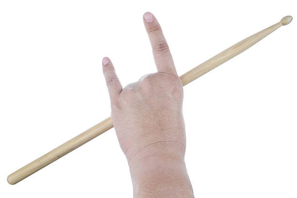 istock Isolated male left hand holding drum stick 512205034