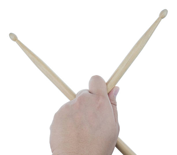 istock Isolated male left hand holding drum sticks 512205080