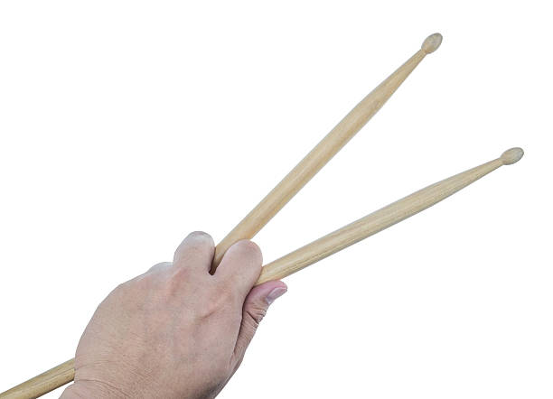 istock Isolated male left hand holding drum sticks 512205192