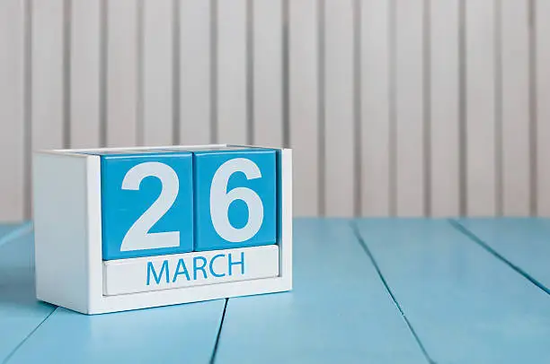 March 26th. Image of march 26 wooden color calendar on white background.  Spring day, empty space for text. Purple DAy is the international day for epilepsy awareness