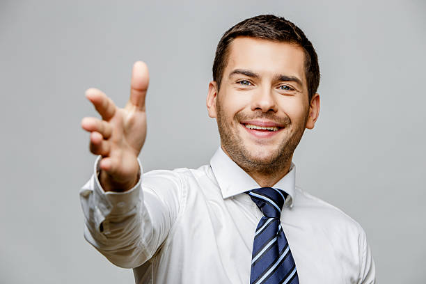 istock Handsome stylish businessman on grey background 512206760