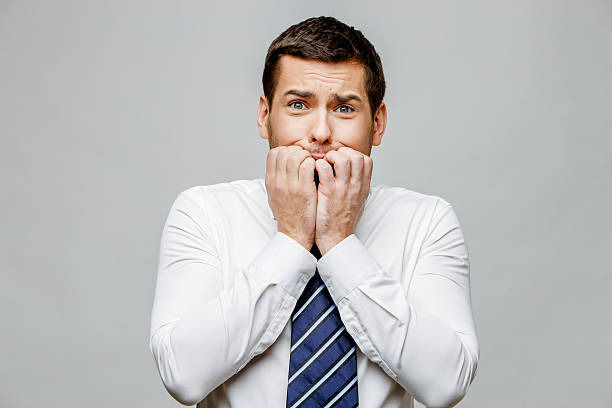 istock Handsome stylish businessman on grey background 512207860