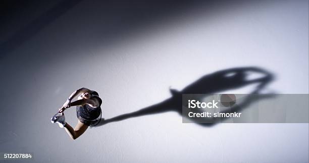 Female Figure Skater Performing Upright Spin Variation Stock Photo - Download Image Now