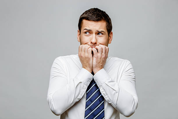 istock Handsome stylish businessman on grey background 512207986