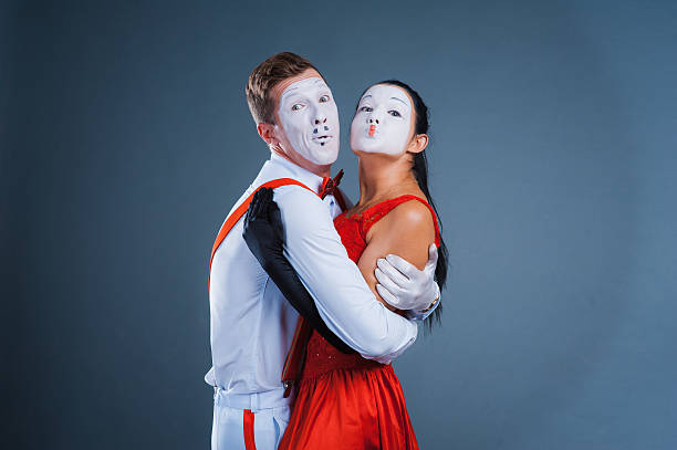 istock two funny mimes isolated on gray background 512208398