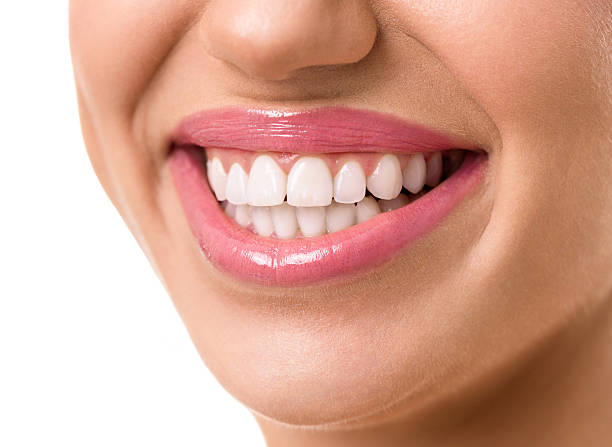 istock young attractive woman face with a clean white teeth 512208444