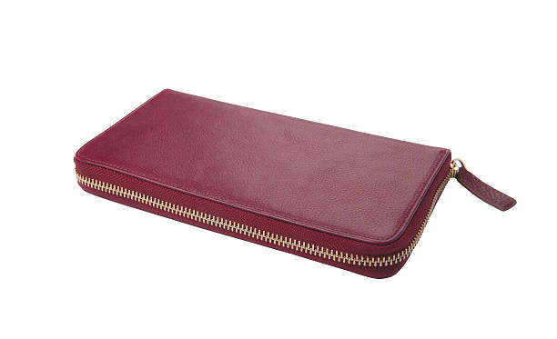 istock Women's purse with a zipper, purple, white background 512210558