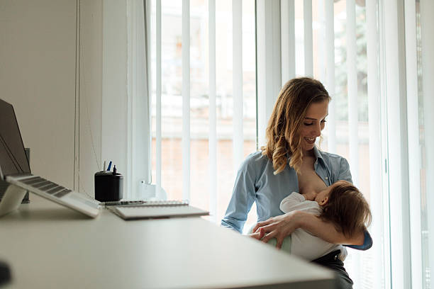 istock Mother Working and breastfeeding her baby 512210790